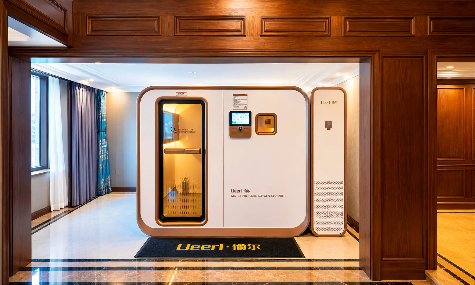 Ueerl room-style hyperbaric chamber in a premium hotel wellness suite