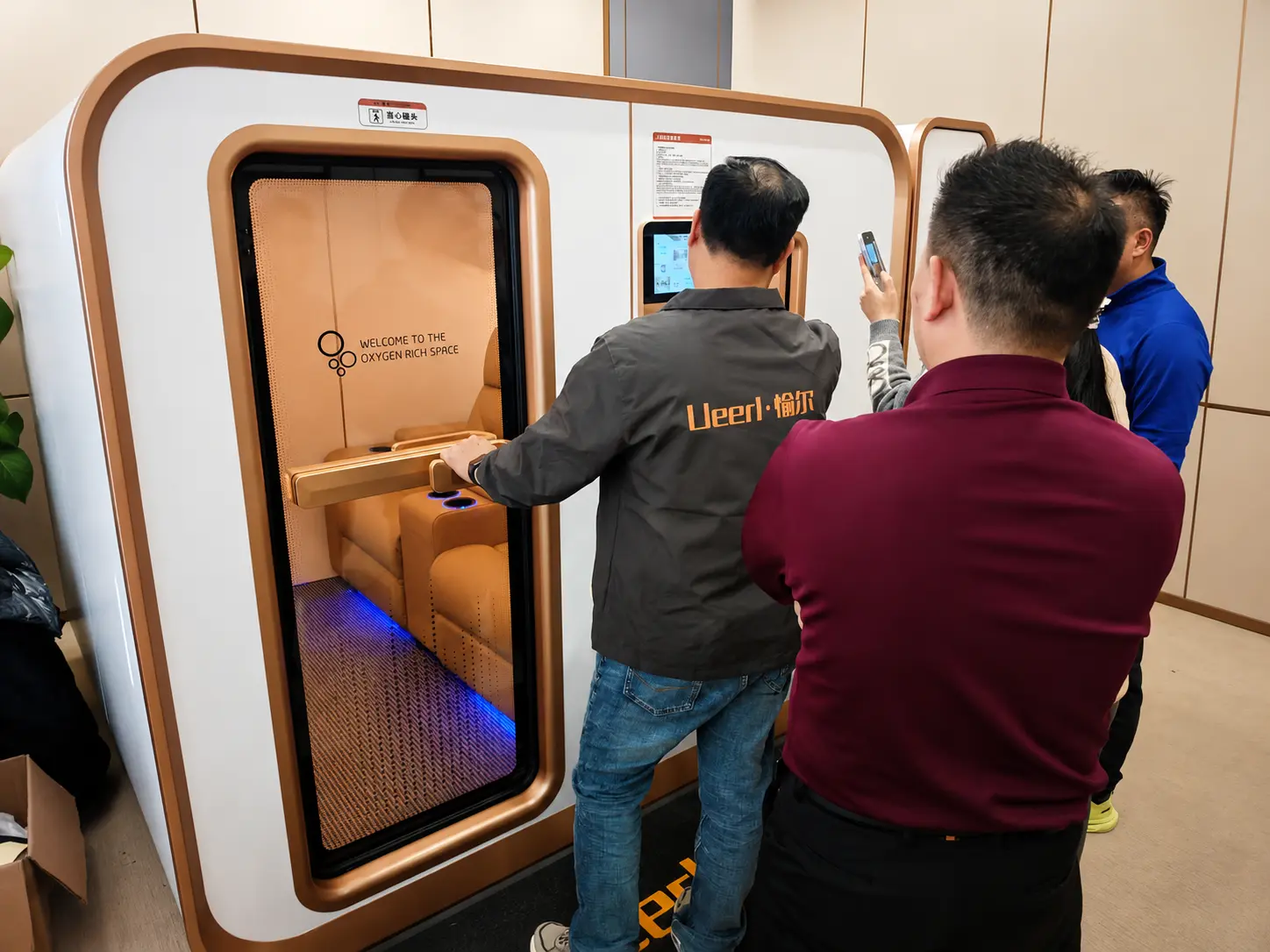Ueerl room-style hyperbaric oxygen chamber integrated into a modern executive office wellness space