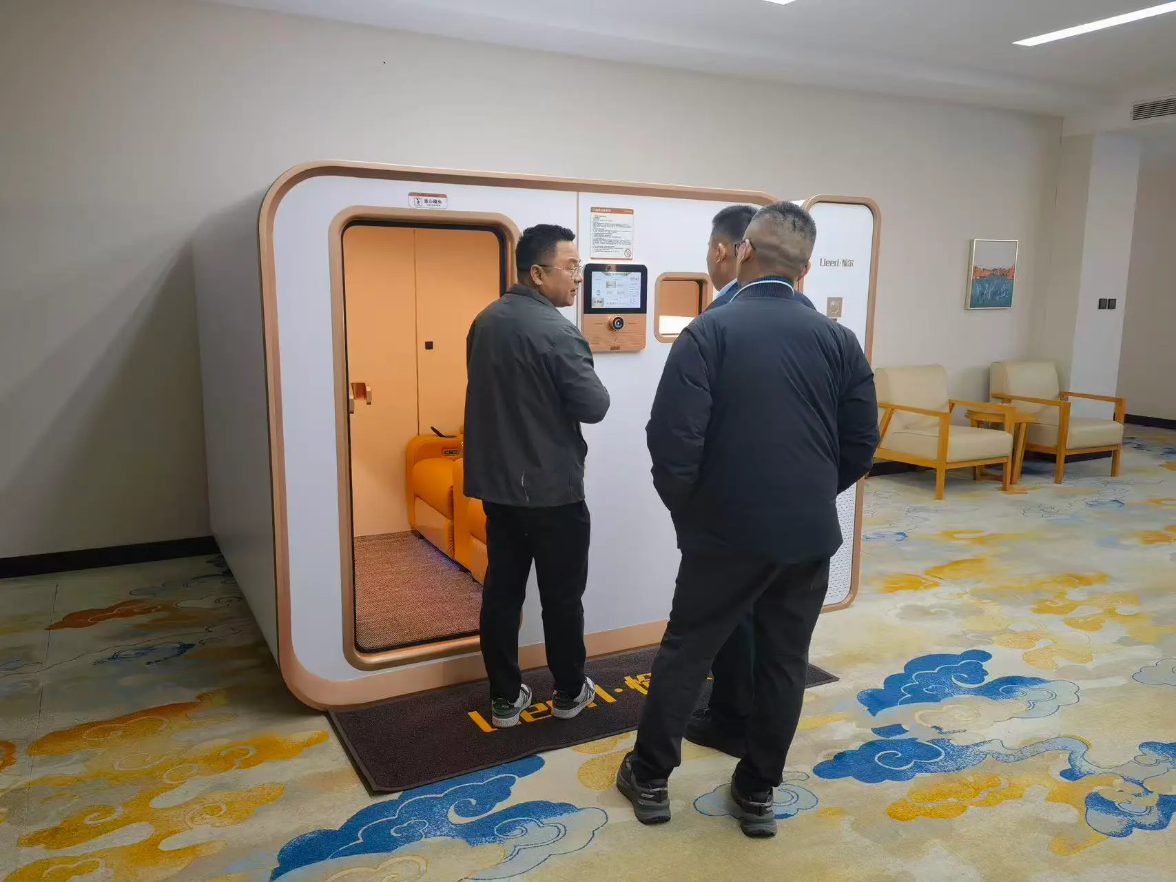 Ueerl room-style hyperbaric oxygen chamber demonstrated in a professional health and wellness center